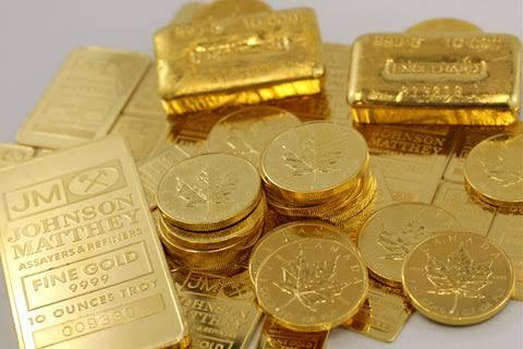 Gold bars and maple leaf coins including Johnson Matthey bullion